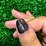 Stefan - a dark brown linear holo with shimmer