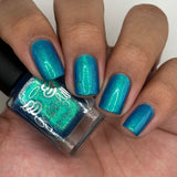 Frozen tundra - deep turquoise-blue base with a sprinkling of chrome chameleon and holo flakes