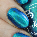 Frozen tundra - deep turquoise-blue base with a sprinkling of chrome chameleon and holo flakes