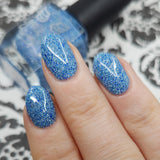 Ice Cave - a steel blue packed with reflective glitter and sapphire holo glitter