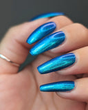 Frozen tundra - deep turquoise-blue base with a sprinkling of chrome chameleon and holo flakes