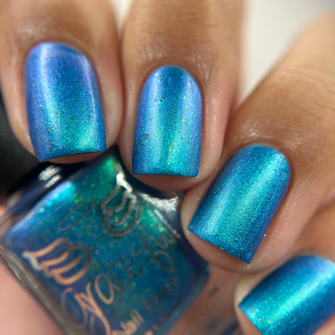 Frozen tundra - deep turquoise-blue base with a sprinkling of chrome chameleon and holo flakes