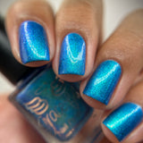 Frozen tundra - deep turquoise-blue base with a sprinkling of chrome chameleon and holo flakes