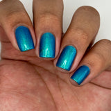 Frozen tundra - deep turquoise-blue base with a sprinkling of chrome chameleon and holo flakes