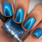 Frozen tundra - deep turquoise-blue base with a sprinkling of chrome chameleon and holo flakes