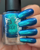 Frozen tundra - deep turquoise-blue base with a sprinkling of chrome chameleon and holo flakes