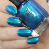 Frozen tundra - deep turquoise-blue base with a sprinkling of chrome chameleon and holo flakes