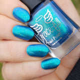 Frozen tundra - deep turquoise-blue base with a sprinkling of chrome chameleon and holo flakes