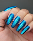 Frozen tundra - deep turquoise-blue base with a sprinkling of chrome chameleon and holo flakes