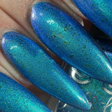 Frozen tundra - deep turquoise-blue base with a sprinkling of chrome chameleon and holo flakes