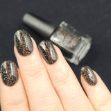 All Hallows’ Evening   A black jelly base with holo flakes and an orange shimmer