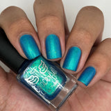 Frozen tundra - deep turquoise-blue base with a sprinkling of chrome chameleon and holo flakes