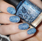 Ice Cave - a steel blue packed with reflective glitter and sapphire holo glitter