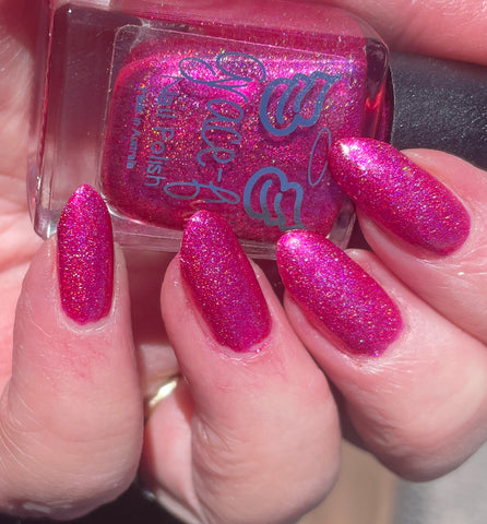Mrs Claus’s bikini -  a gorgeous bright pink linear holo. Full of shimmer this polish looks great in and out of the sun.