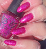 Mrs Claus’s bikini -  a gorgeous bright pink linear holo. Full of shimmer this polish looks great in and out of the sun.