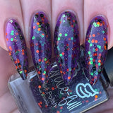 Ghouls and Boo’s  A purple jelly with green and orange metallic glitter and black matte glitter