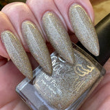 Turtle Dove - clear base polish is packed full of teeny super holographic glitter in gold and silver.