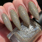Turtle Dove - clear base polish is packed full of teeny super holographic glitter in gold and silver.