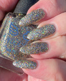 Tinsel - Our New Year’s Eve polish - with a clear base this polish is packed full of black, silver and gold super holographic glitter.