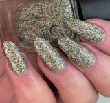 Tinsel - Our New Year’s Eve polish - with a clear base this polish is packed full of black, silver and gold super holographic glitter.