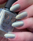 Stop the Rain - with a blue - gold base this polish has light blue aurora shimmer and gold metallic flakes