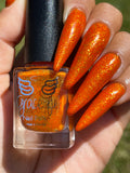 Temporal Essence is an orange jelly base with mini gold metallic flakes