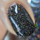 I Believe - a black jelly base this polish is full of silver holo reflective glitter and gold super holographic glitter