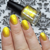 Who is She? -Aurora shimmer makes this polish a really strong pretty yellow polish. It even moves to green in low lights.