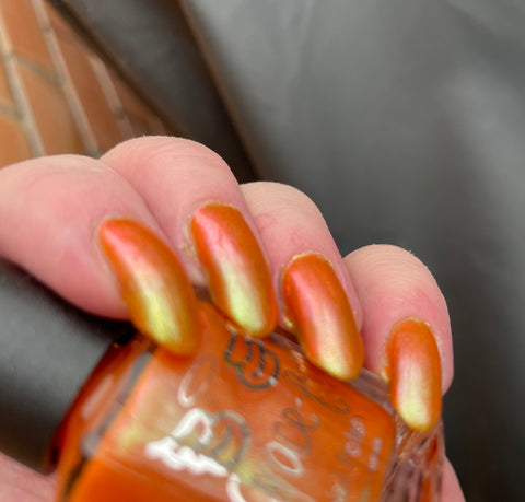 It’s all Humbug, I tell you - orange base with a contrasting Aurora shimmer in green, gold and a subtle pink/red shift.
