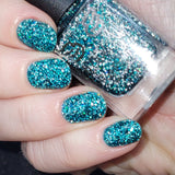 Flight of fancy - a deep green base with reflective holo glitter and three sizes of sea green holo glitter