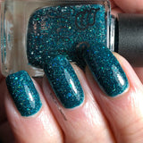 Flight of fancy - a deep green base with reflective holo glitter and three sizes of sea green holo glitter